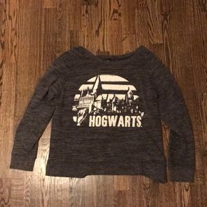 Dark gray sweater with white Hogwarts printing